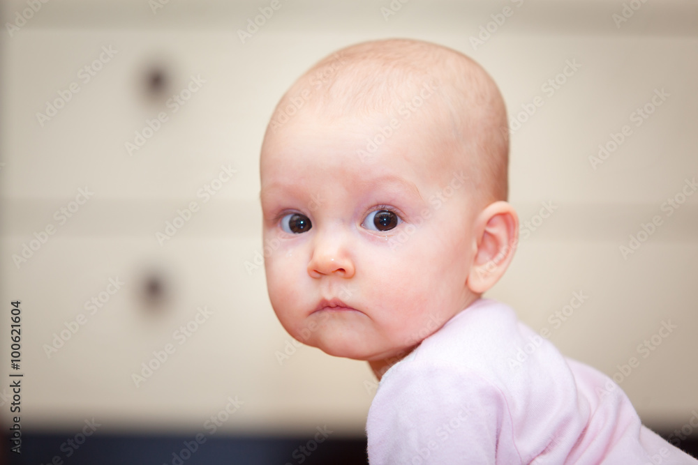 Close-up of a small child who cries but does not scream. A tear rolling down his cheek. Blurred background. Photo girl. Close-up of a small child who cries but does not scream. A tear rolling down his cheek. Blurred background. Photo girl.