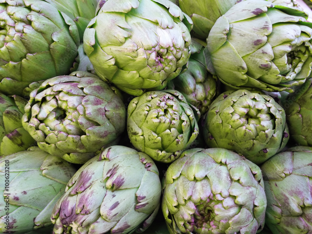 Fototapeta premium Some artichokes in a market. Natural vegetables.