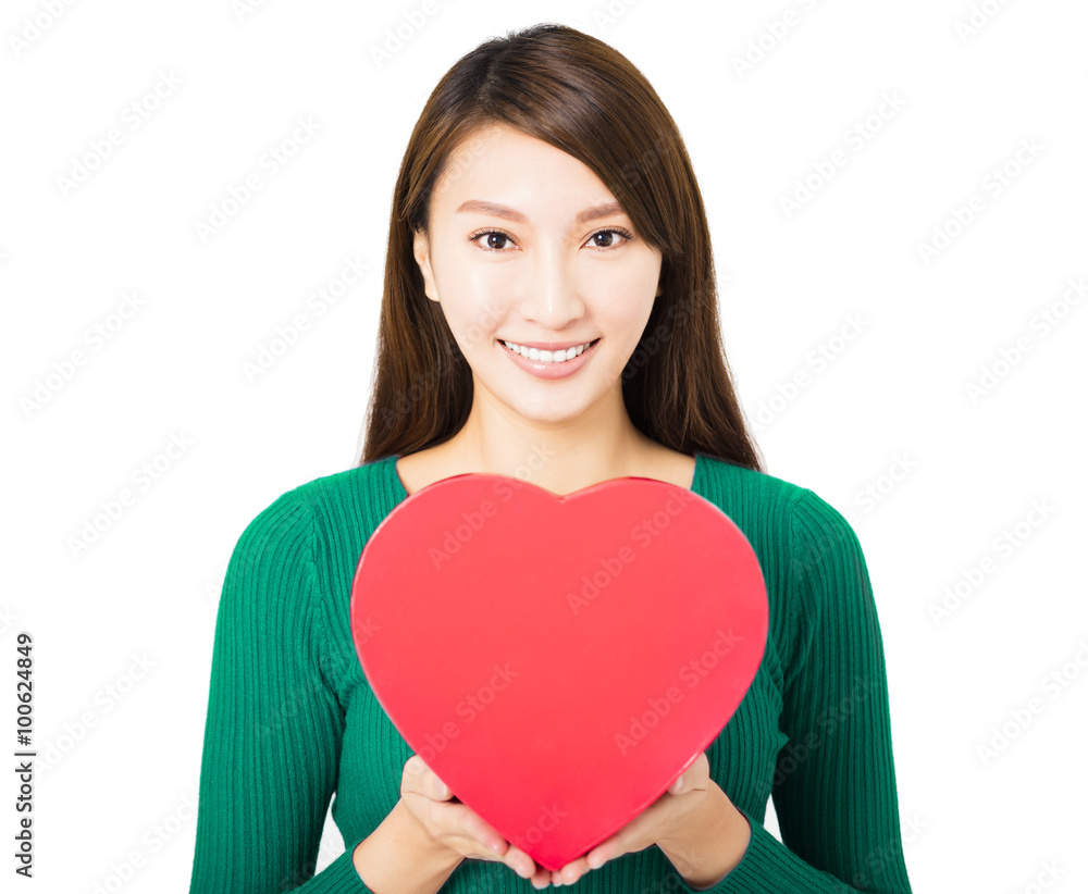 beautiful young woman holding red heart gift box beautiful young woman holding red heart gift box
