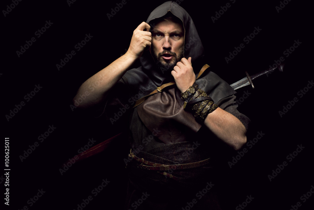 Fototapeta premium Viking warrior with sword over black background
