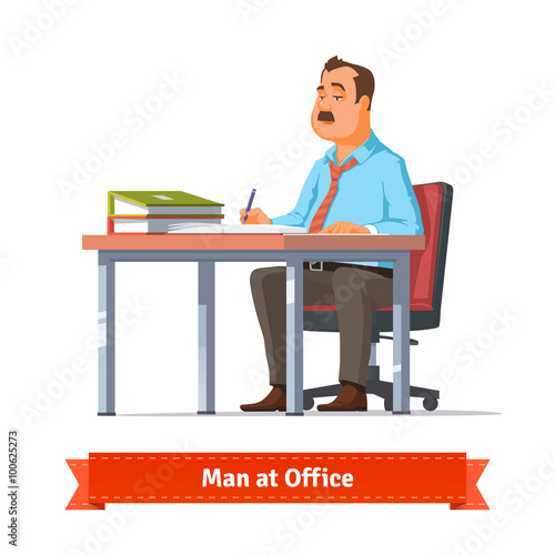 Man writing at the office table