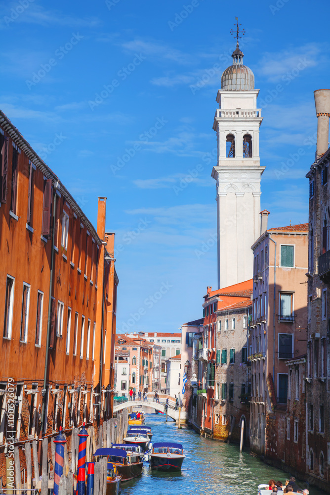 Narrow canal with bridge in Venice
