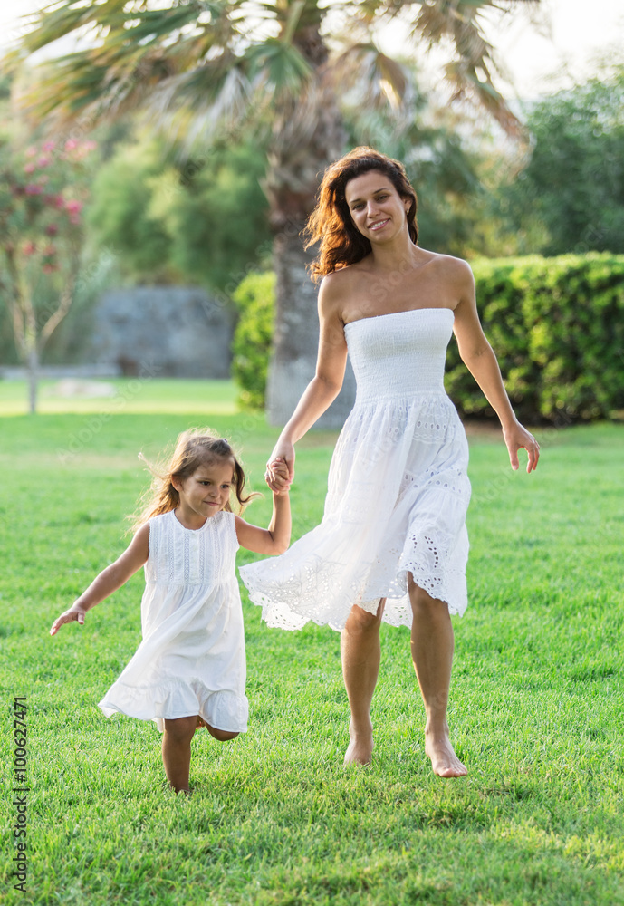 Mother and daughter are resting in the country side. Mother and daughter are resting in the country side.