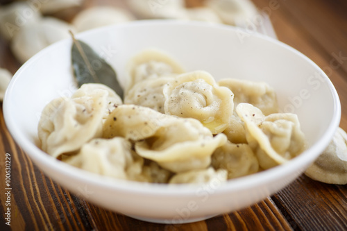 boiled dumplings with meat in a white plate