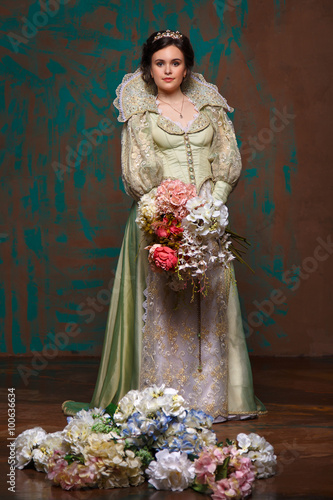 beautiful haughty queen in royal dress.
