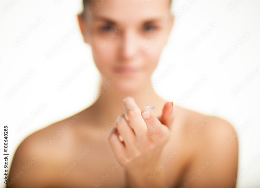 Woman with contact lens on finger healthcare concept Woman with contact lens on finger healthcare concept