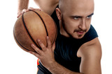 Close up portrait of serious basketball player on white backgrou