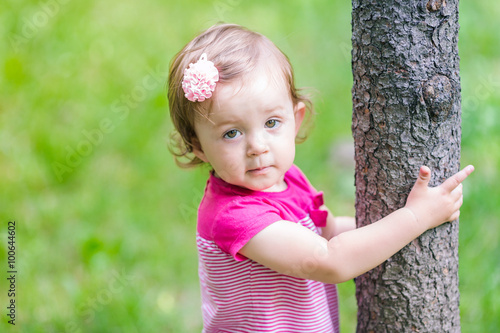 Beautiful baby girl playing outdoor © len44ik