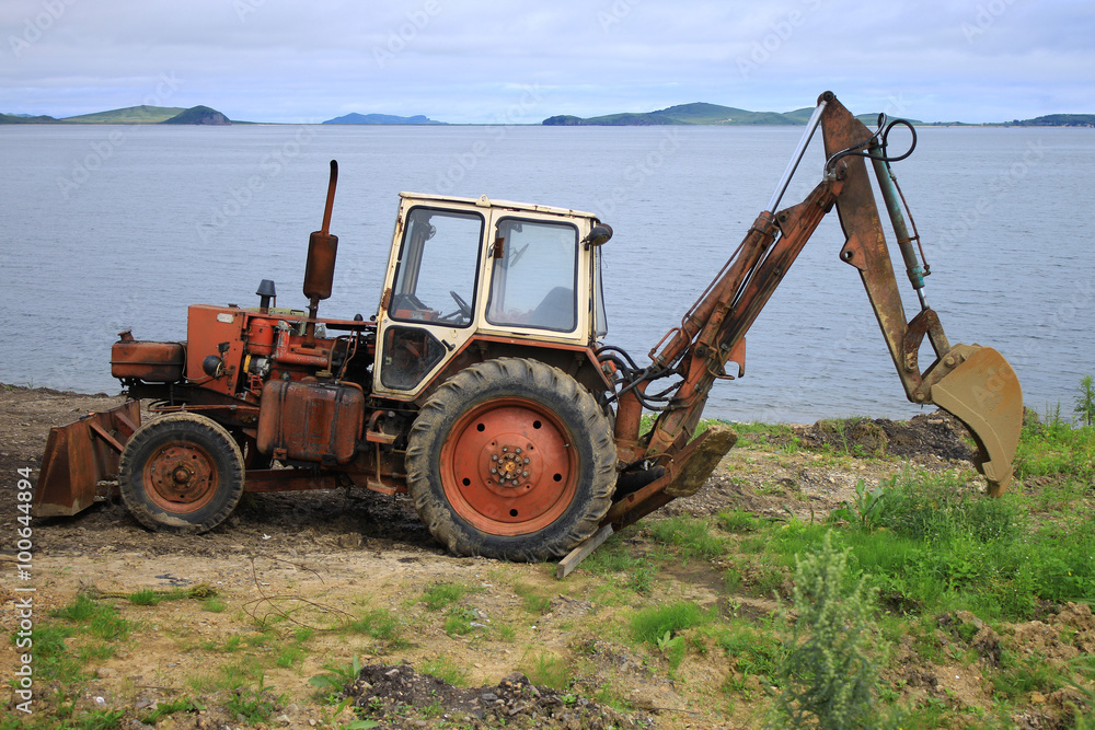 Rusty tractor on the beach