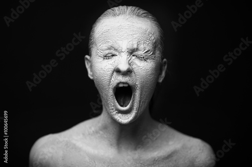 silent scream. Art studio shot girl in a white body art photo
