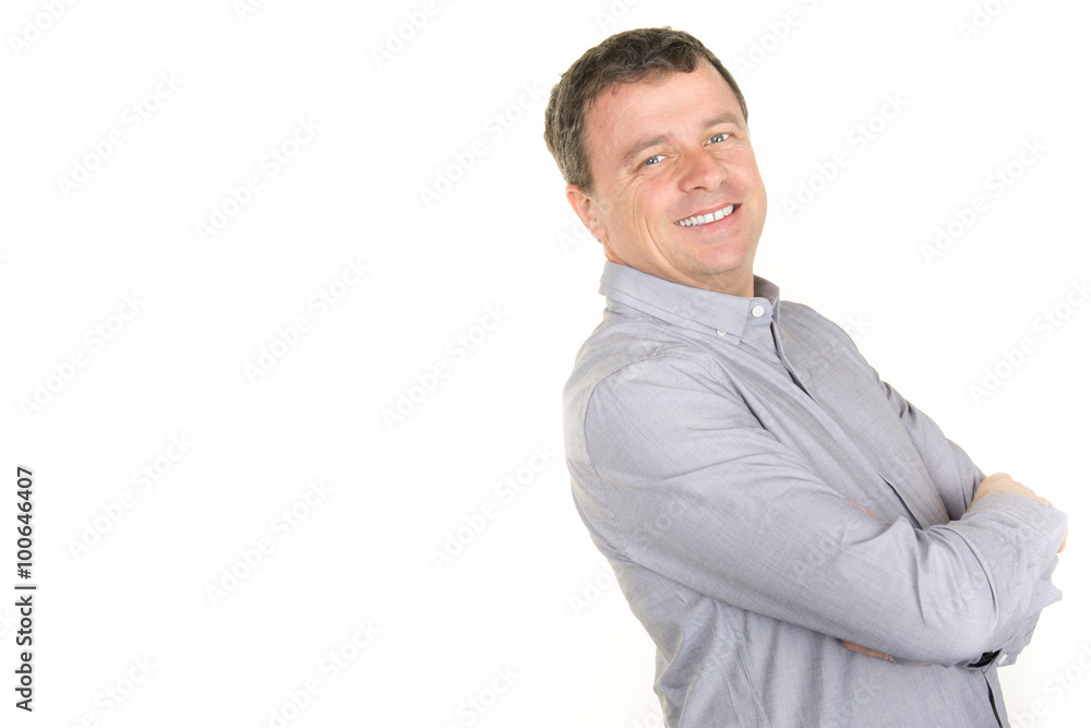 Happy smiling man leaning against white wall with copy space Happy smiling man leaning against white wall with copy space