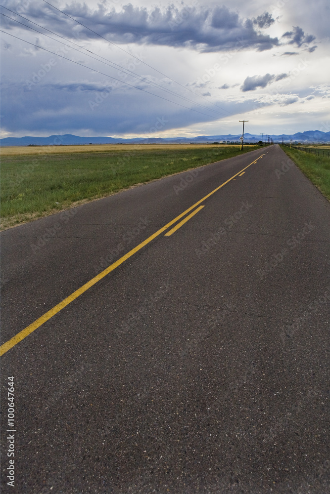Fototapeta premium Storm clouds and highway road in Colorado