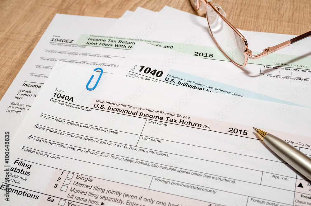 1040 US tax form for 2016 year with pen and glasses Stock Photo | Adobe ...