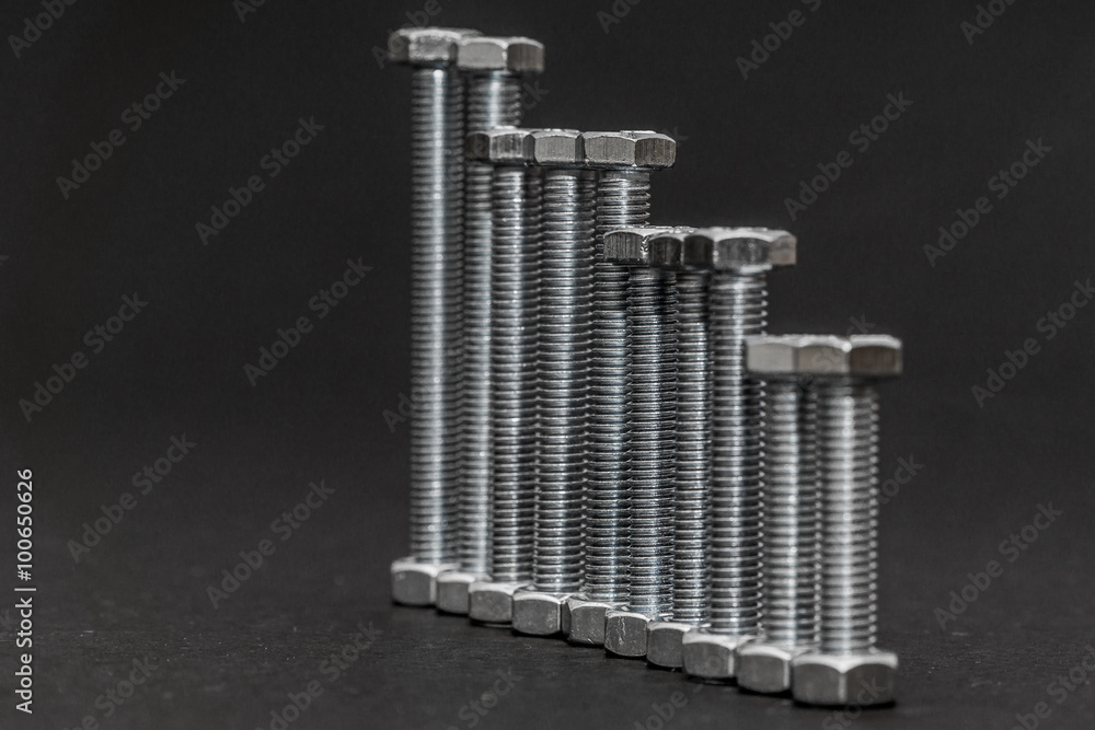 nuts and bolts on a gray background