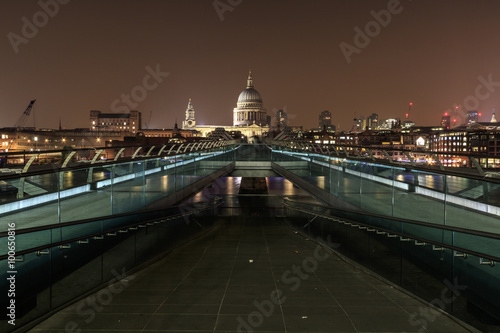 Millennium Bridge and St Pauls Cathedral at night in London