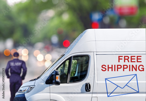 Fast delivery, van on city street blured bokeh background