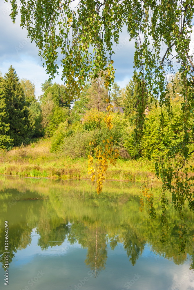 Autumn landscape with a cloudy day, lake and forest Autumn landscape with a cloudy day, lake and forest