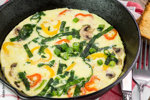 Fresh cooked omelette with vegetables.