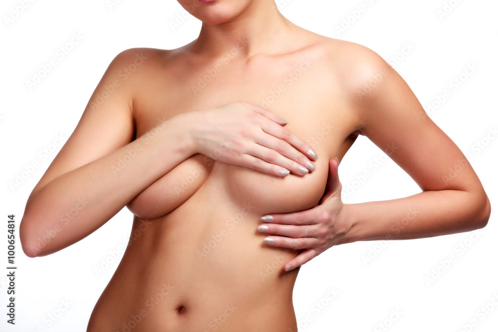 Female controlling breast for cancer, isolated on white Female controlling breast for cancer, isolated on white