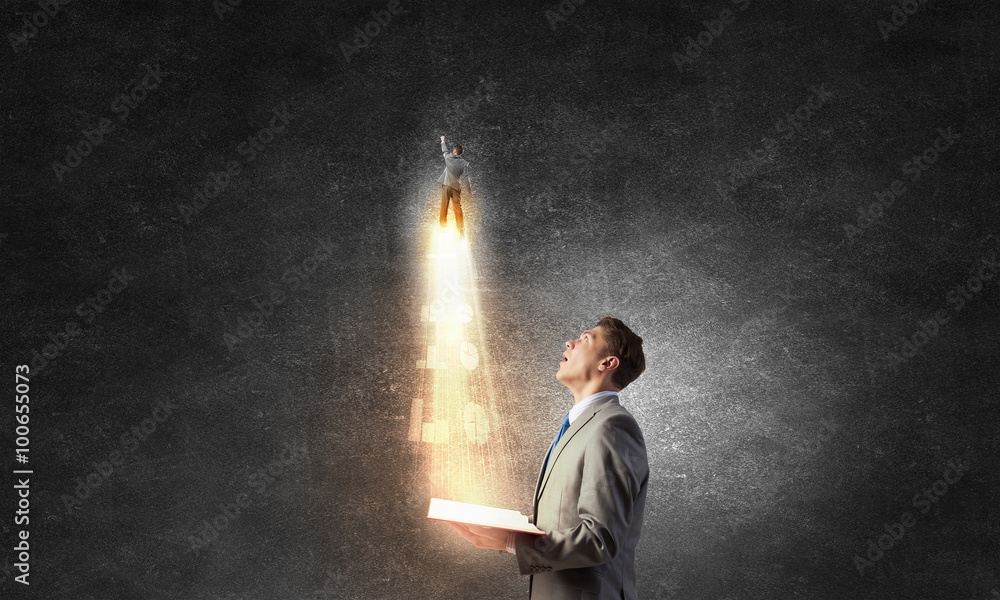 Businessman with book in hands