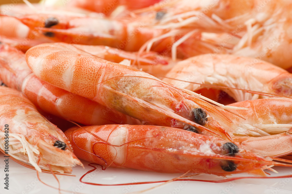 Group of fresh raw shrimp with lemon slice Group of fresh raw shrimp with lemon slice