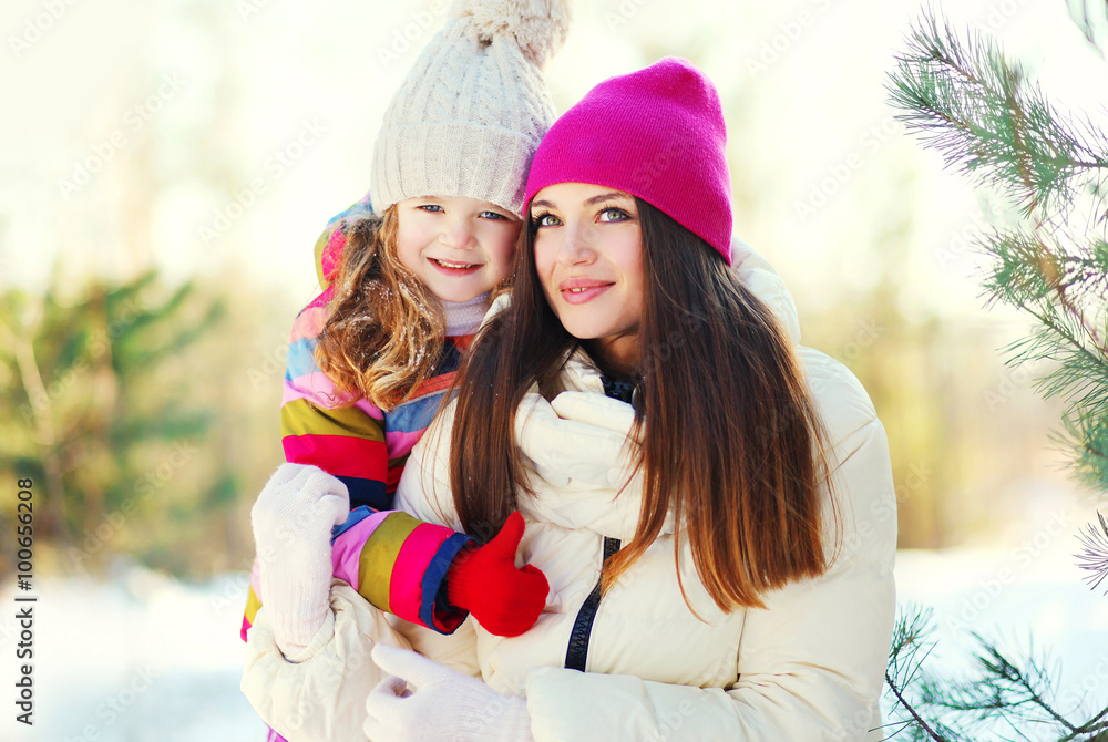 Obraz premium Happy mother and child together in winter day