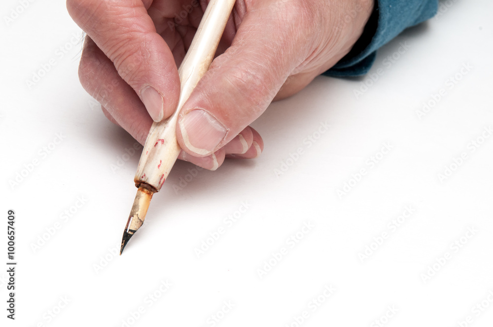 Man using a calligraphy pen with space to add text Man using a calligraphy pen with space to add text
