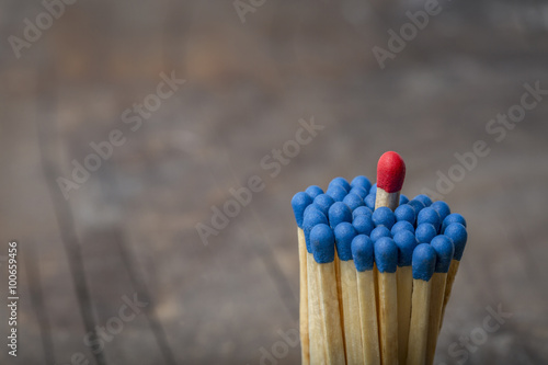 Red Match in group of blue matches