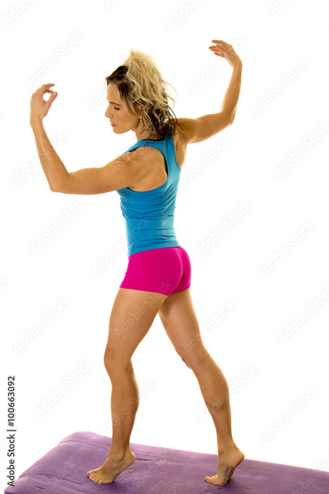 woman blue tank and pink shorts fitness back look side