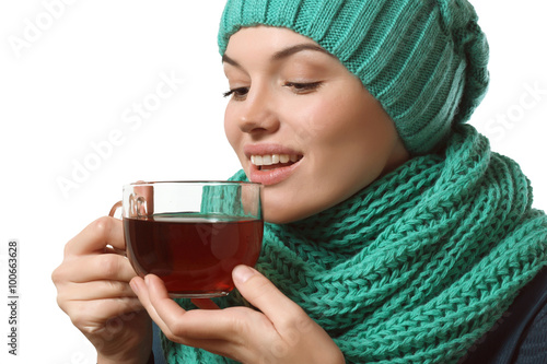 cold, beautiful girl drinking tea