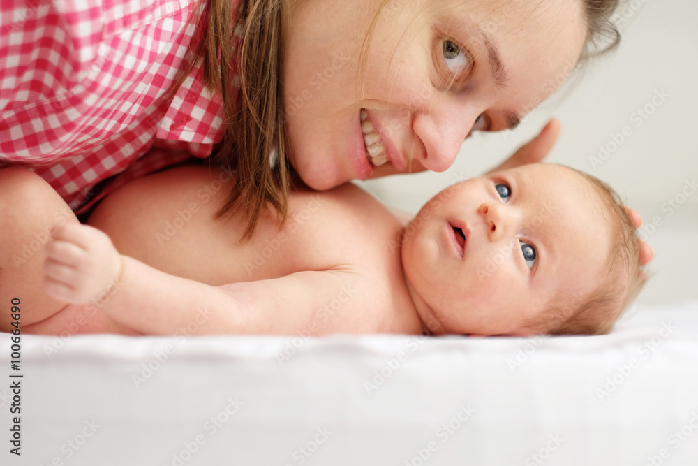 One month old newborn baby with mother One month old newborn baby with mother