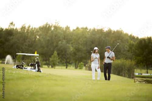Young couple at golf court