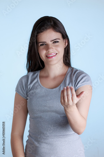 Wallpaper Mural Beautiful young woman with inviting gesture with his hand. Isola Torontodigital.ca