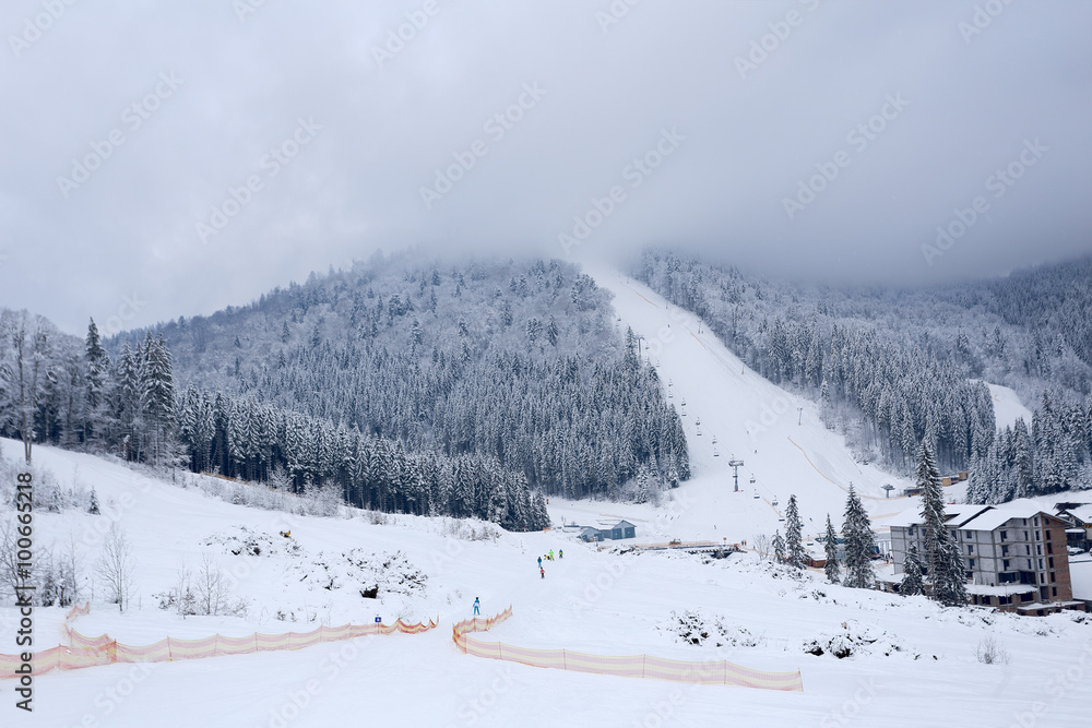 Landscape winter ski slopes in sport village