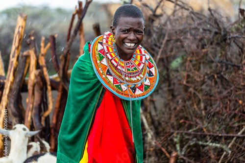 Massai woman standing in her village