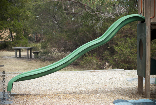 green slide at a public park