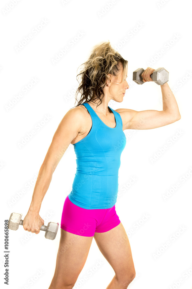 woman blue tank and pink shorts fitness weights flex one side woman blue tank and pink shorts fitness weights flex one side