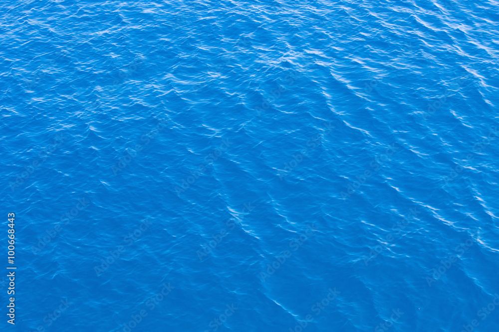 Blue sea surface with waves