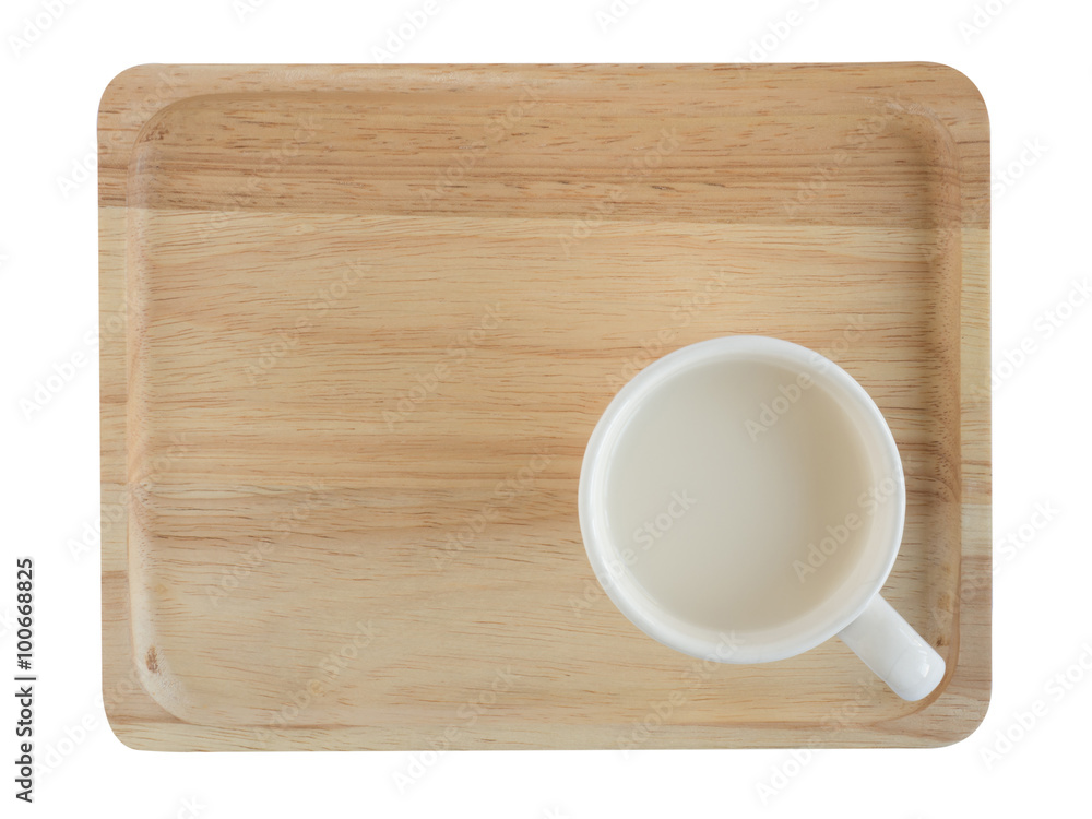 Cup of milk on the wooden tray isolated on white Cup of milk on the wooden tray isolated on white