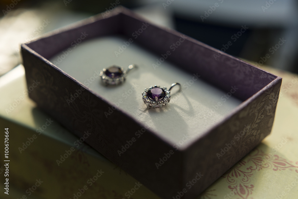 silver earrings with amethyst and sapphire in a box silver earrings with amethyst and sapphire in a box
