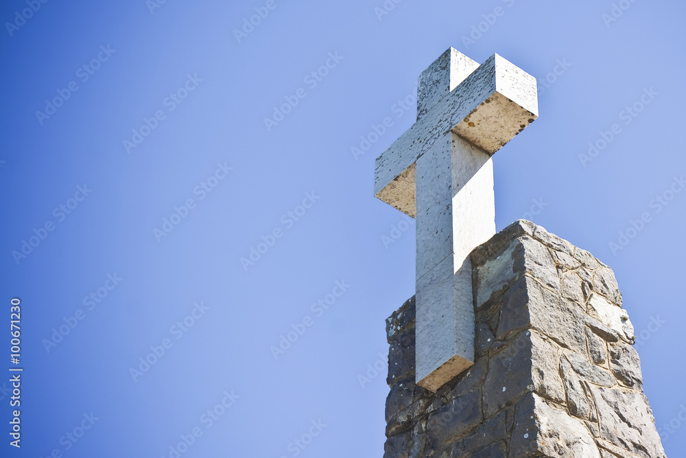 Christian cross in blue background - image with copy space
