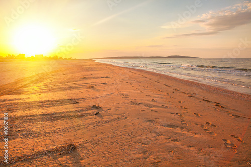 sunset over empty beach