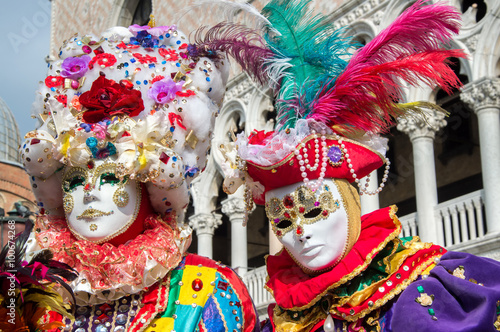 Colorful masked couple at Venice carnival