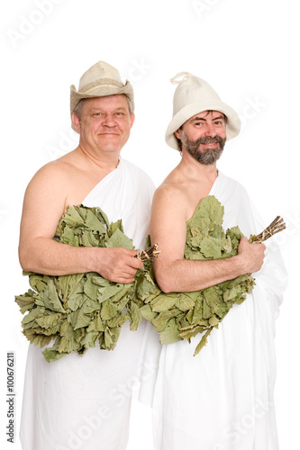 Happy men with oak twigs in bathing costumes. From a series of Russian bath. photo