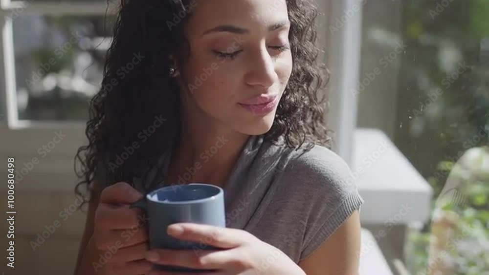 Cute casual brunette gazing out a window Cute casual brunette gazing out a window