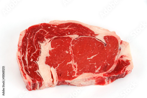 fresh raw rib eye steak on white background