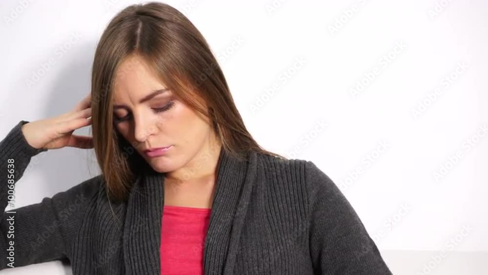 Woman sad stressed sitting on couch at home 4K Woman sad stressed sitting on couch at home 4K