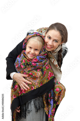 A young woman with little girl in Russian kerchiefs