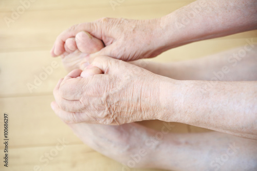 Senior man stretching to hold toes   © nebari