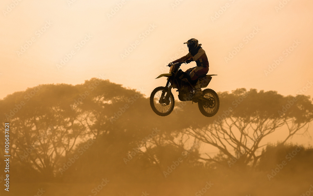 silhouette of motocross rider jumping in track silhouette of motocross rider jumping in track
